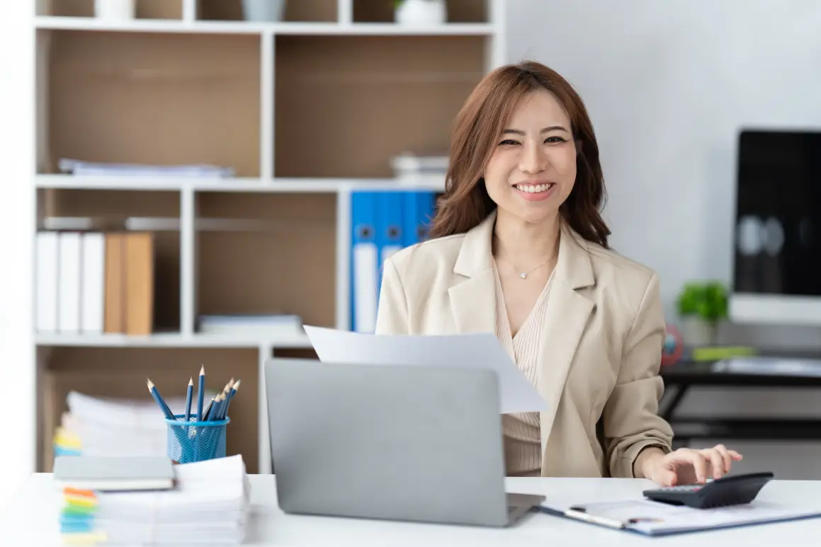 asian-woman-working-with-laptop-in-her-office-bus-2026-01-07-05-36-30-utc